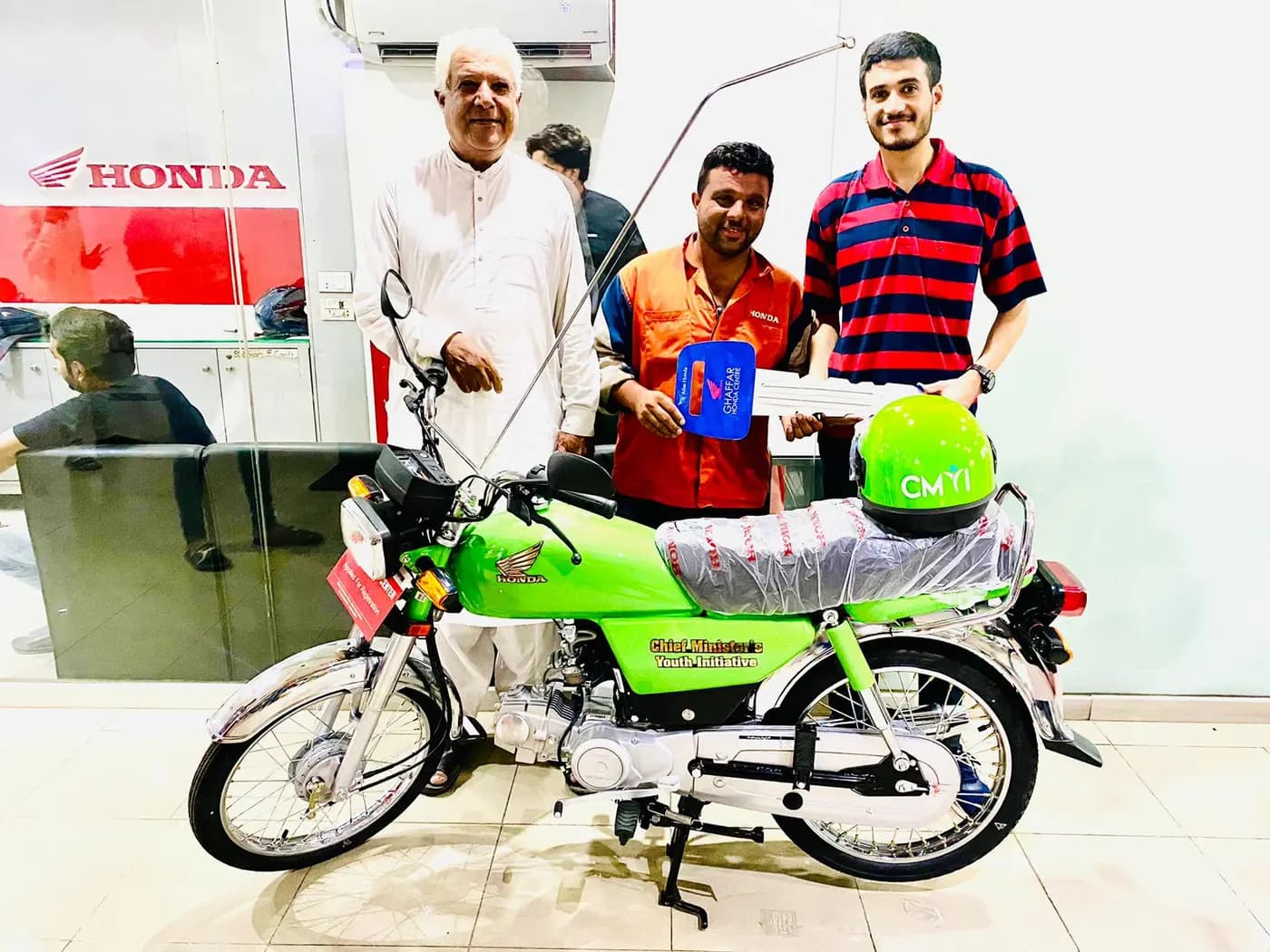 Young scheme applicants receiving their bikes — the program targets 18 to 35 year olds