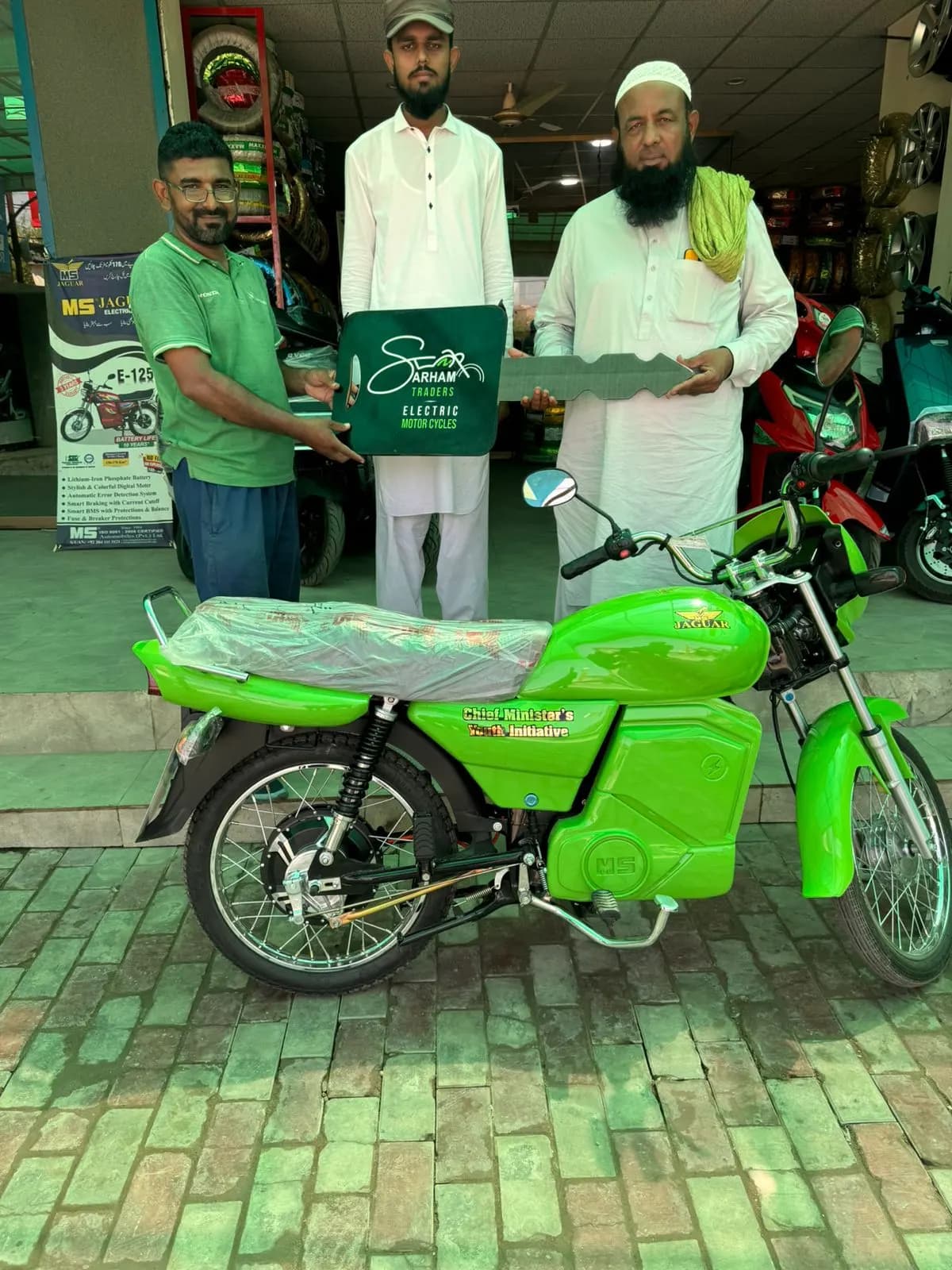 A family collecting their son's new scheme bike together at the dealership