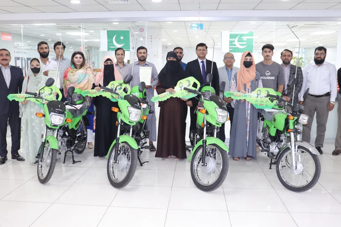 New green scheme motorcycles lined up for delivery
