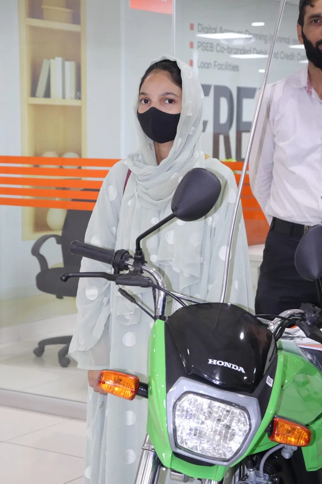 Scheme beneficiaries collecting their new bikes — delivery photo 1